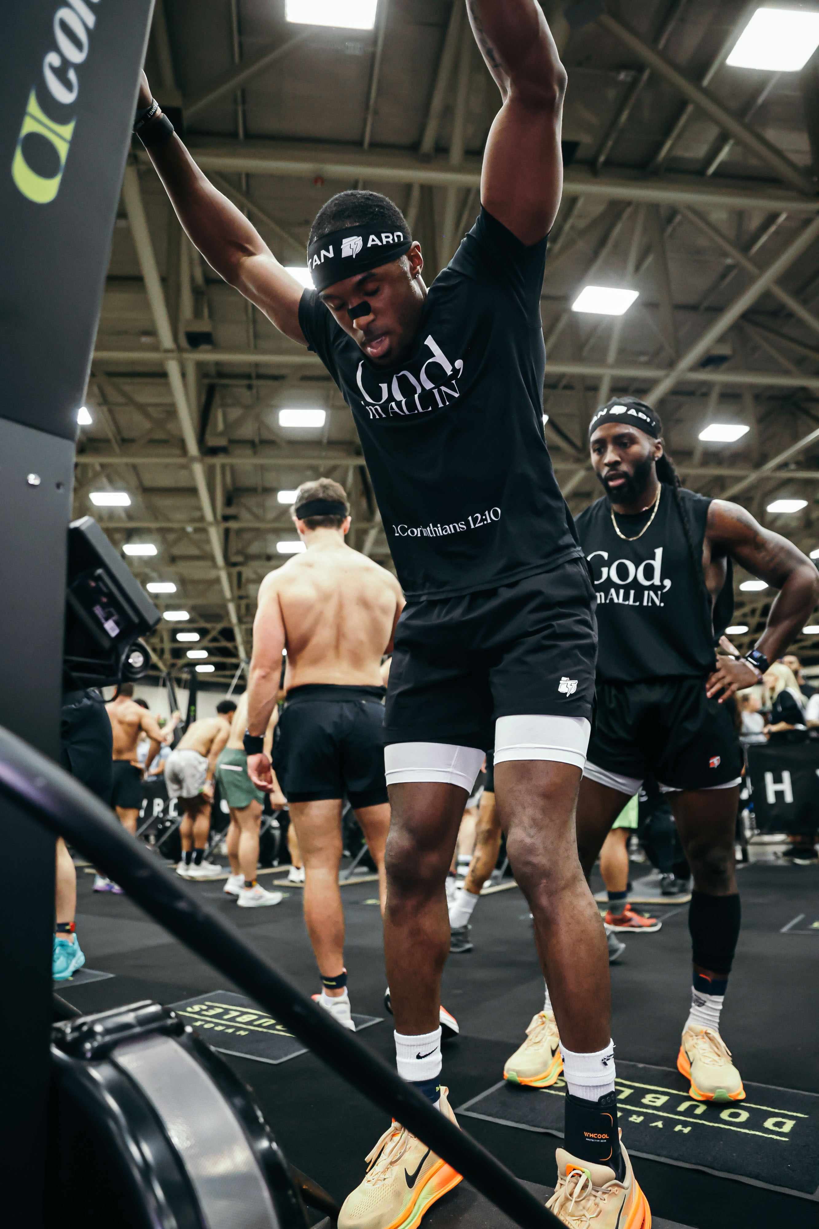 Community member performing burpees over box during HYROX competition